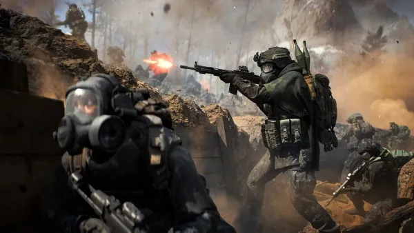 A group of soldiers in combat gear are engaged in a fierce battle. They are equipped with rifles and other military equipment, wearing helmets and gas masks. The background is a war-torn landscape with smoke and fire, indicating an intense firefight or explosion. The scene captures the chaos and danger of modern warfare.