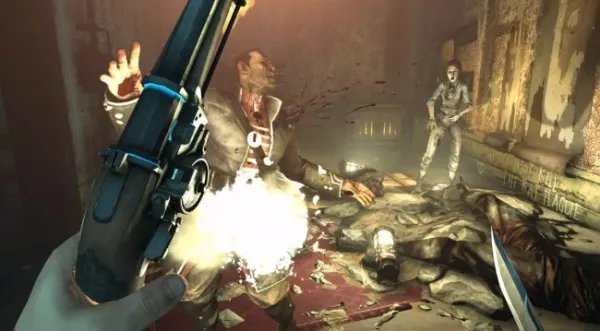A first-person perspective of a video game scene, featuring a character holding a gun with blue accents and firing at an enemy in a dimly lit, post-apocalyptic setting. The environment is cluttered with debris and other defeated enemies, creating a tense atmosphere. 
