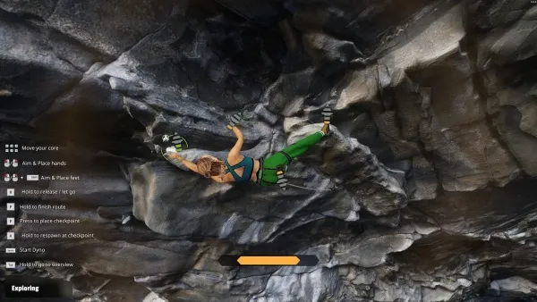 A female rock climber in a green harness and helmet scales a rugged cliff face, her body poised mid-climb as she grips the jagged rocks with determination. The scene is set against a backdrop of steep, shadowed cliffs under a clear sky, highlighting the climber's focus and strength.