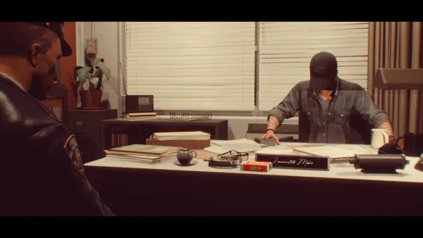 A man in a denim shirt and baseball cap is sitting at an office desk, signing documents. The desk has various items on it including books, a coffee cup, and a nameplate that reads "Jameson Pike." Another person stands nearby observing the process. The room features a window with blinds partially open, allowing some light to enter, and there's a plant on a shelf in the background.