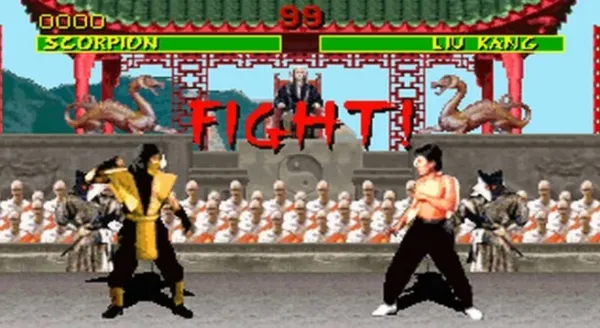 A pixelated fighting game scene featuring Scorpion and Liu Kang from Mortal Kombat, with a traditional Chinese temple backdrop, spectators in the stands, and a "FIGHT!" sign above them. The health bars at the top show Scorpion's name on the left and Liu Kang's on the right, with their respective health levels indicated by numbers. 