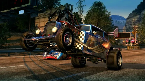 A high-energy scene featuring a custom-built, checkered-patterned hot rod performing a wheelie on an urban street at dusk. The car's large tires and exposed engine components highlight its off-road capabilities. In the background, another vehicle is visible, along with city lights and power lines, creating a dynamic contrast between the natural landscape and the man-made environment.