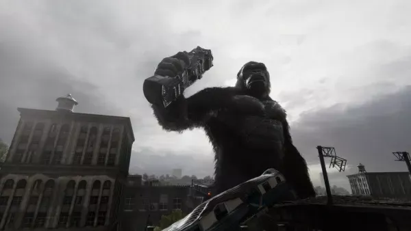 A towering figure of a giant ape, reminiscent of King Kong, stands atop a cityscape with a raised fist and a fierce expression. The scene is set against an overcast sky, casting dramatic shadows on the surrounding buildings and power lines. The image captures the raw power and intensity of the character in a moment of confrontation or triumph.

