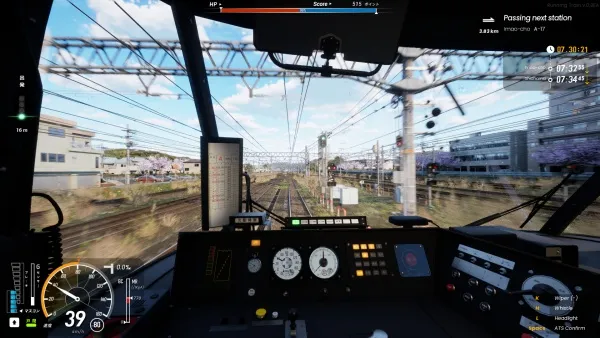 A train driver's cabin view, showcasing the control panel with various gauges and buttons. The speedometer reads 39 km/h, and there are multiple switches and levers visible. Outside the window, power lines stretch across the landscape, leading towards a station sign indicating "Posing next station." The scene is set in a rural area with buildings and trees lining the tracks under a clear blue sky.