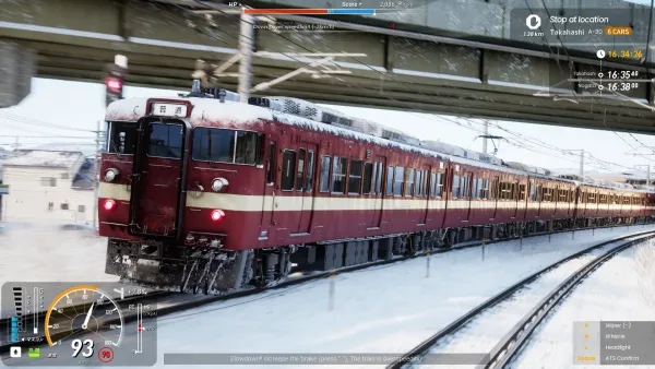 A red and white train traveling through a snowy landscape, with snow-covered tracks and buildings in the background. The train is moving under an overpass, and there are various game interface elements visible, such as speedometer, map, and other controls. The scene appears to be from a video game simulation of a train journey.